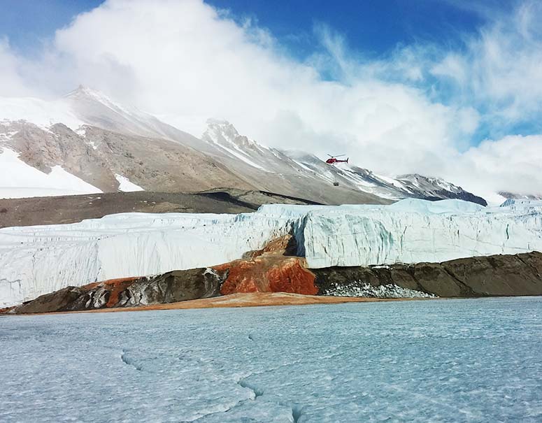 Helicopter over Blood Falls in Antarctica