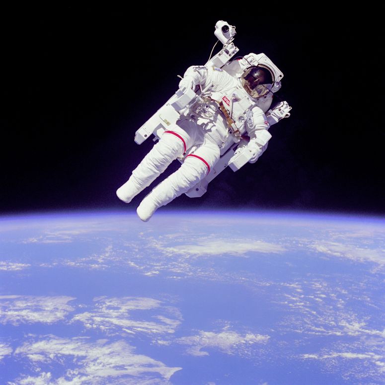 Astronaut Bruce McCandless on a spacewalk without a tether, but with a jet pack.jpg