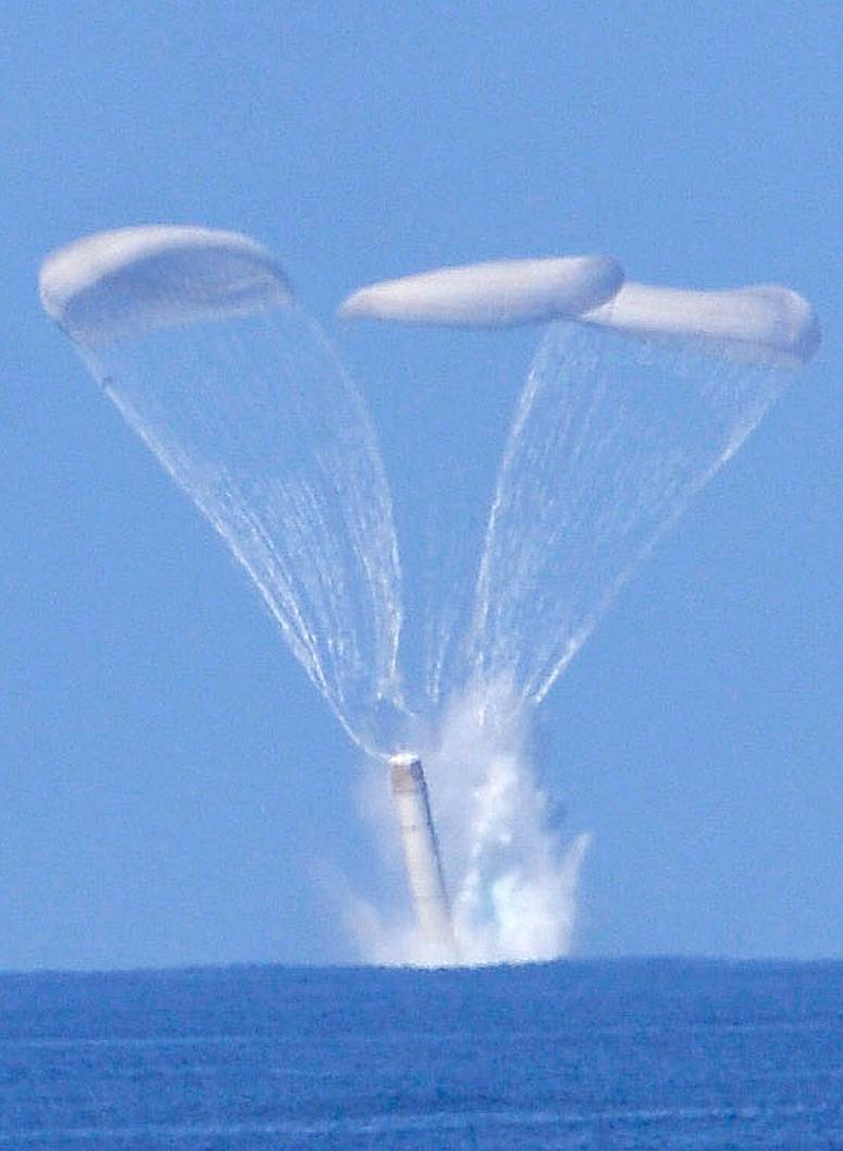 The space shuttle solid rocket boosters (SRBs) landing in the sea.
